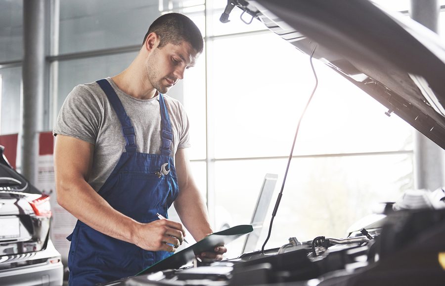 Portrait Of A Mechanic At Work In His Garage - Car Service, Repa